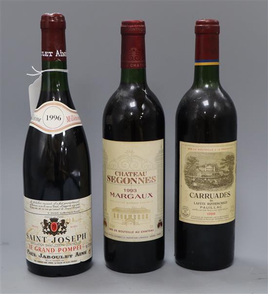 A bottle of Chateau Segennes 1993 Margaux, Carruades De Lafite Rothschild Pauillac 1988 and Saint Joseph Le Grand Pompee,